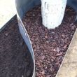 grafmonument, cortenstaal en versteend hout